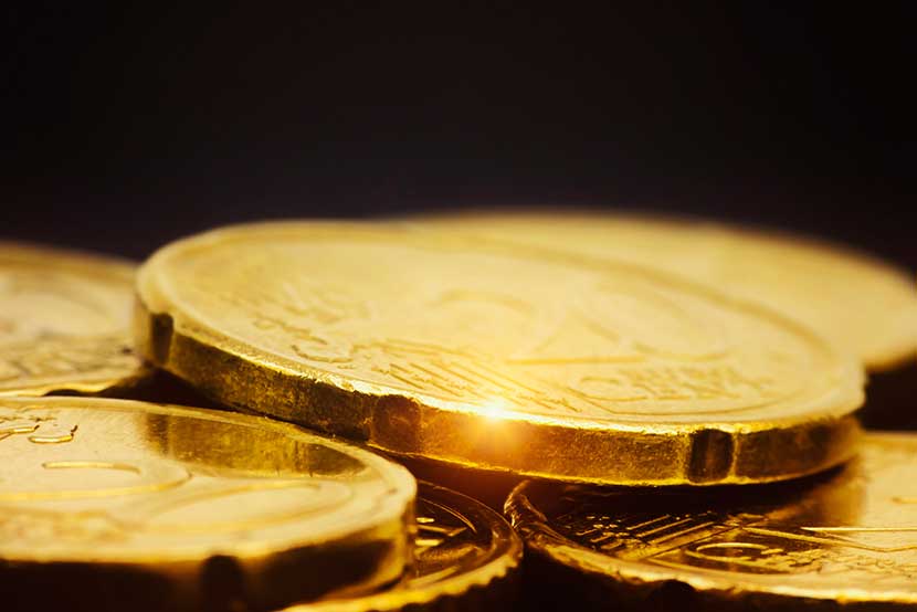 Gold coins reflecting light
