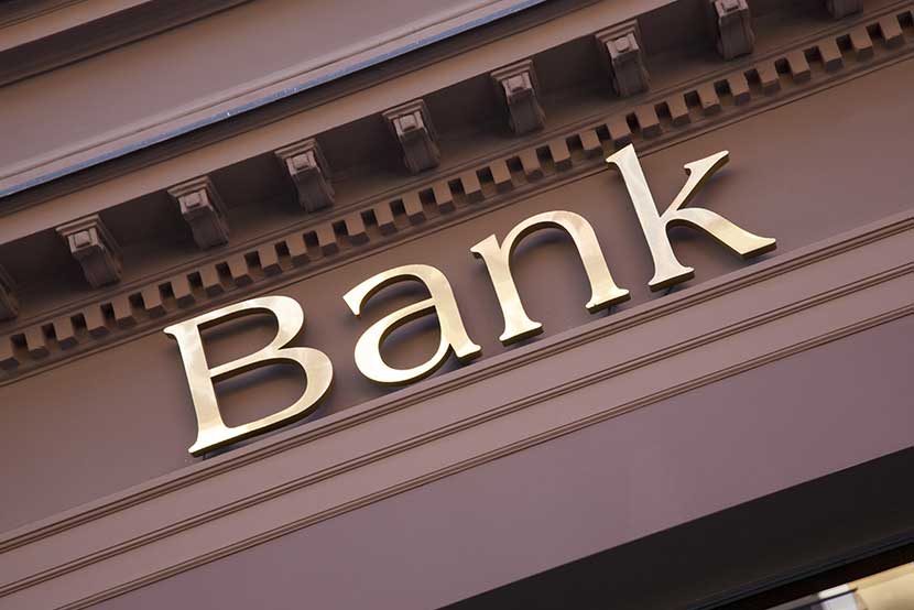 Gold lettering on the front of a brown bank
