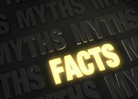 The word FACTS illuminated against dark word MYTHS