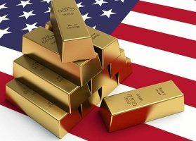 1000 gram gold bars on American flag