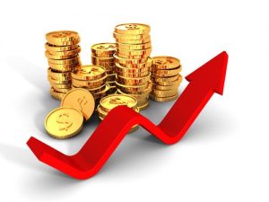 Gold coins marked with the dollar sign and red arrow pointing upwards as gold prices climb