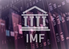 International Monetary Fund logo against purple backdrop of cascading stock market prices