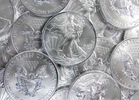 Pile of shiny 1 oz pure silver eagle coins