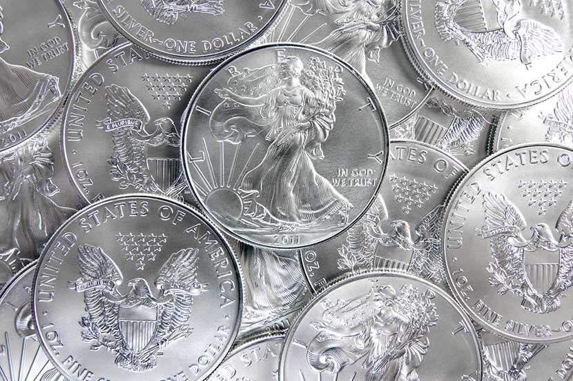 Pile of shiny 1 oz pure silver eagle coins