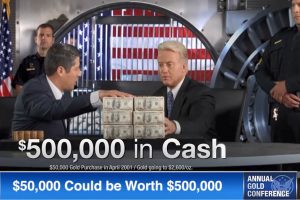 $500,000 in cash sitting on table in front of two men and a gold vault in background