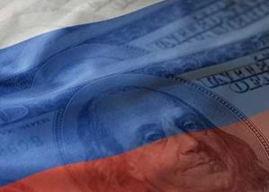 U.S. one hundred dollar bill faded into the Russian flag