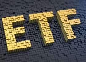 Gold blocks on black background, spelling out ETF