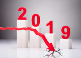 2019 with red arrow descending and cracking ground