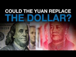 an American dollar bill next to a Chinese yuan being compared