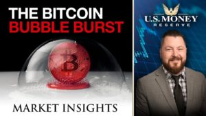 Patrick Brunson presenting next to a red bitcoin inside of a bubble that is about to pop