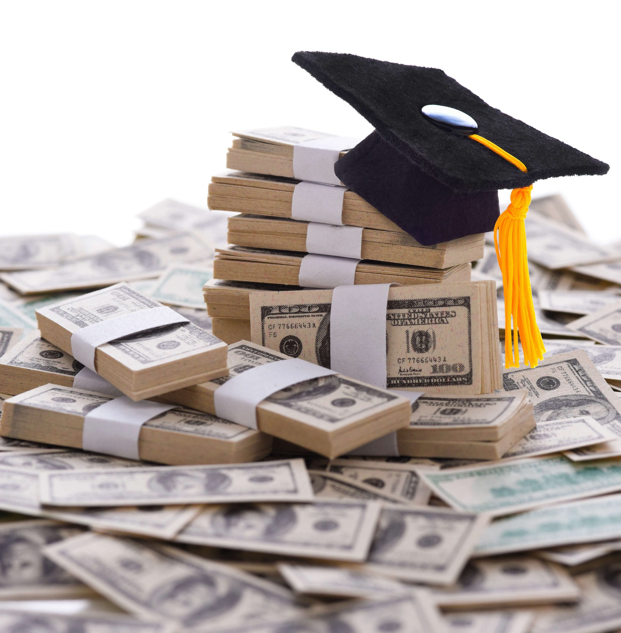 Graduation cap sitting on top of piles of money