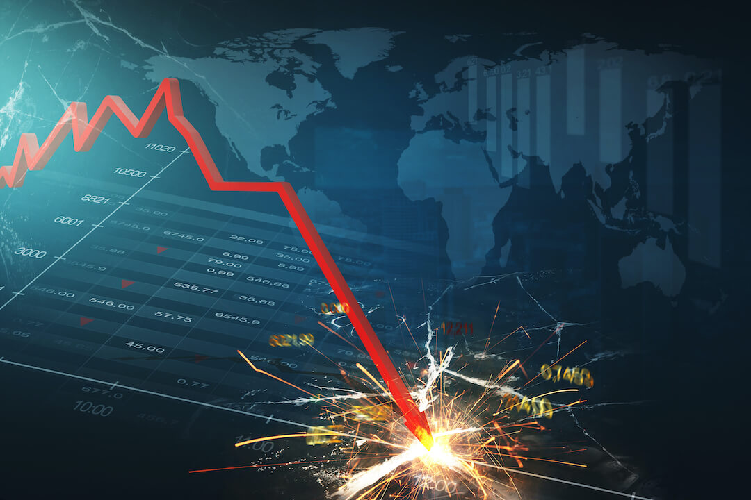 Red arrow crashing downward on stock graphic with world and downward chart in the background