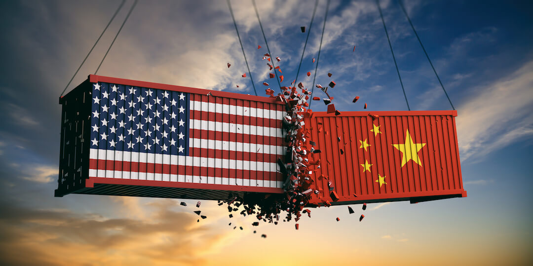 Two shipping containers representing United States and China colliding