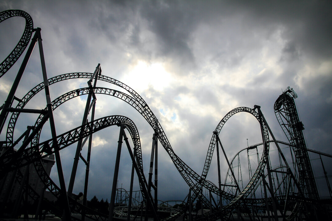 Roller coaster with foreboding dark clouds in the background