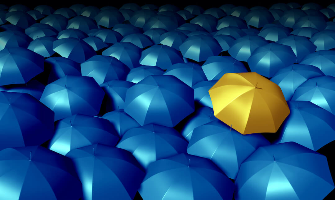 Gold Umbrella In the Midst of Blue Umbrellas