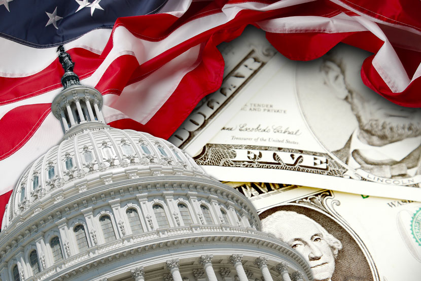 US capitol, American flag sitting on top of US paper money