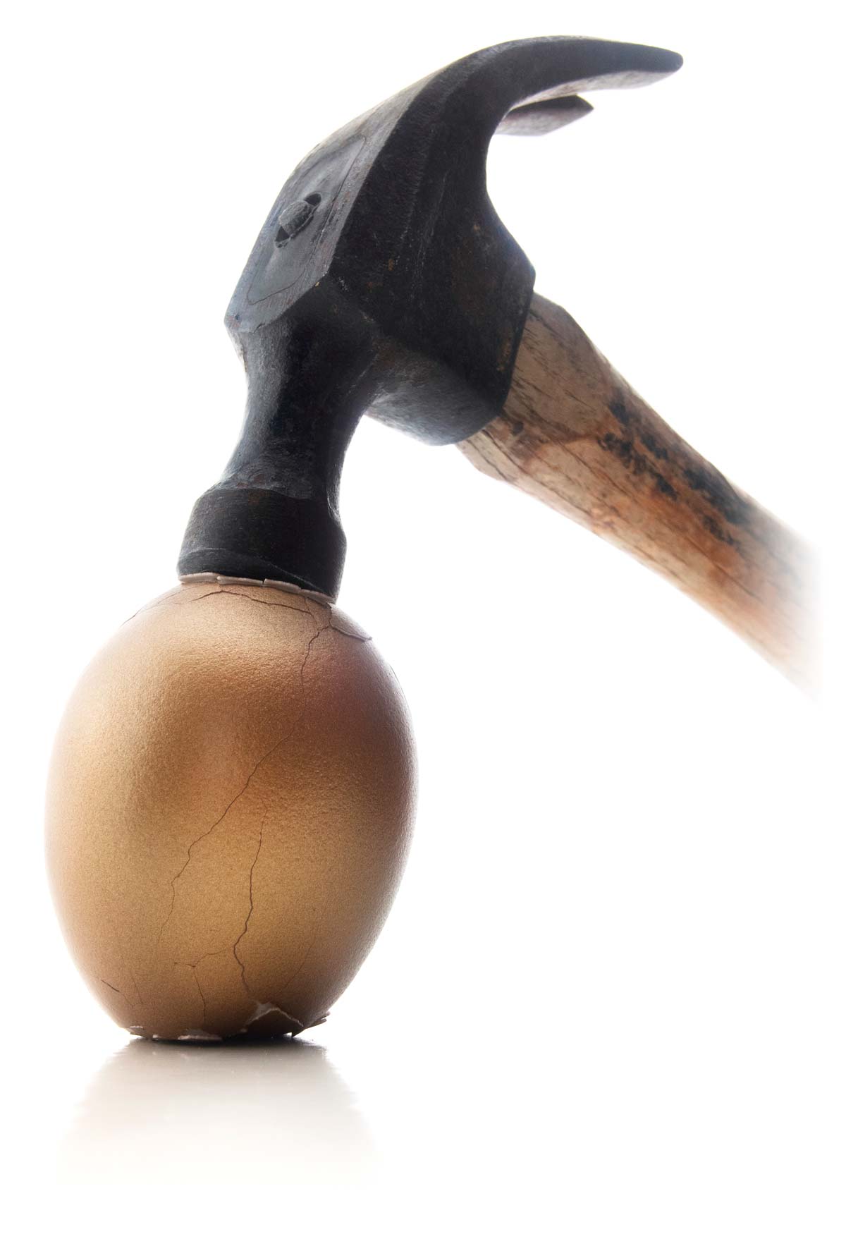 Hammer cracking golden nest egg