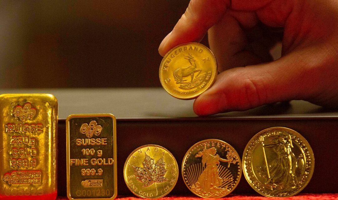 Gold trades lower as stocks give up earlier gains, dollar adds to May advance