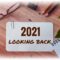 Plaque on office desk reading “2021 LOOKING BACK”