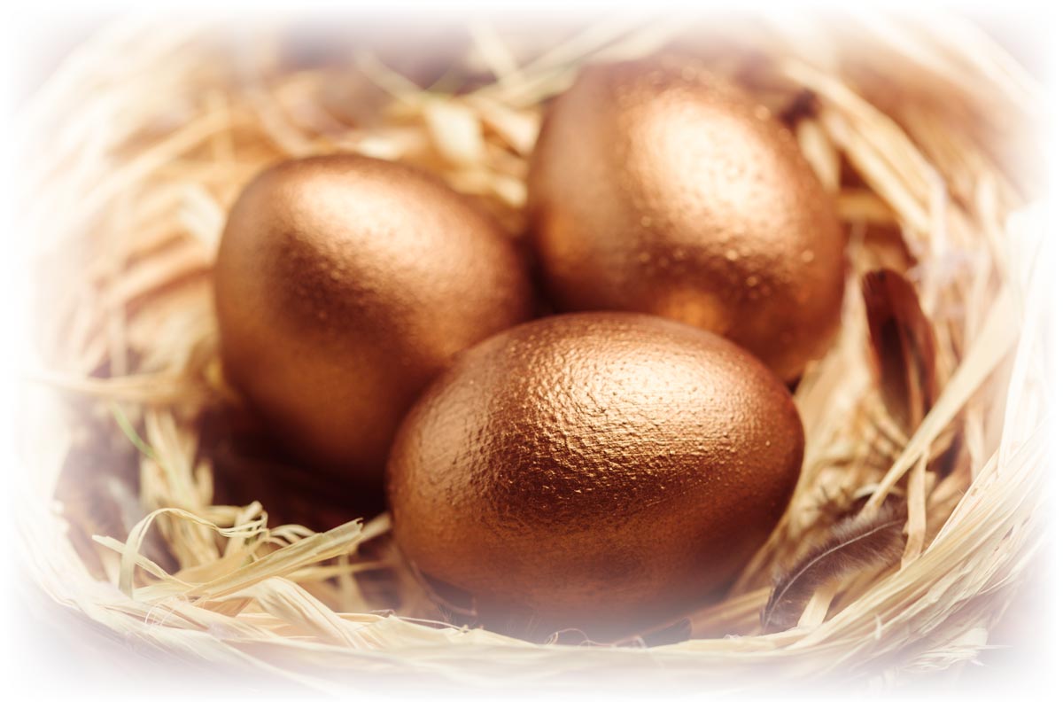 Three golden eggs in basket 