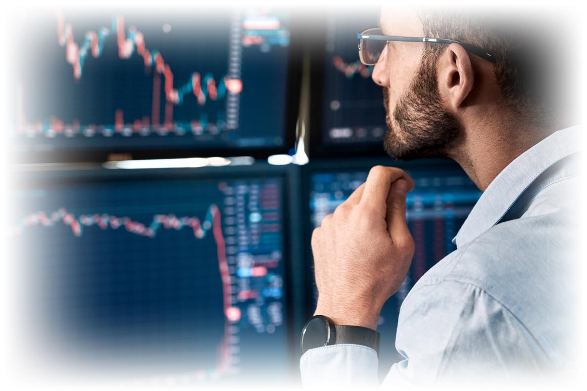 Stock broker looking at downward-moving stock information