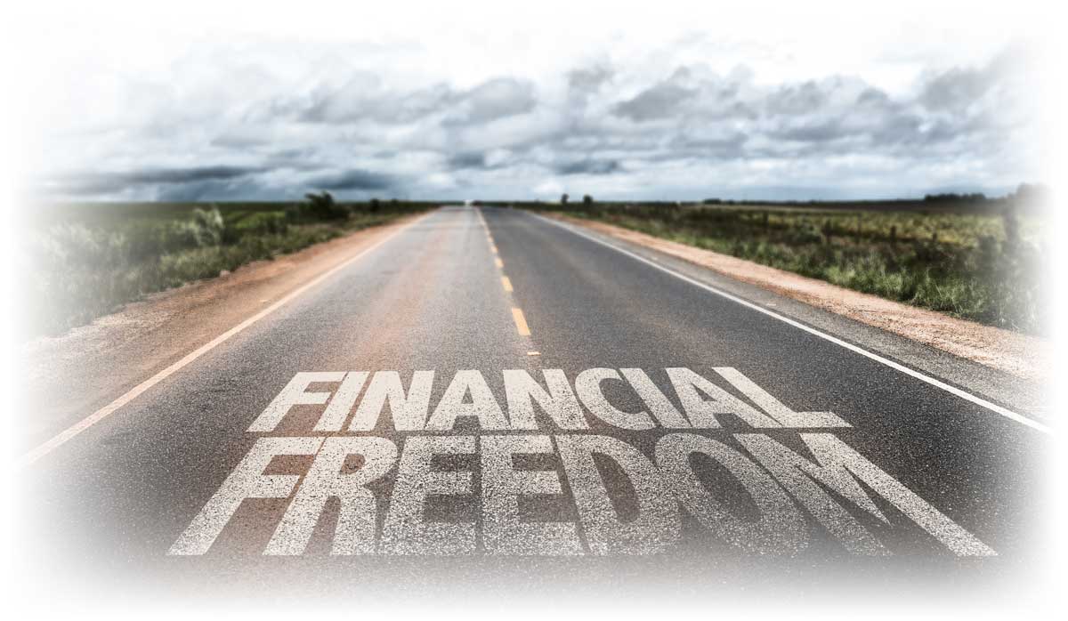 Road painted with words “Financial Freedom”