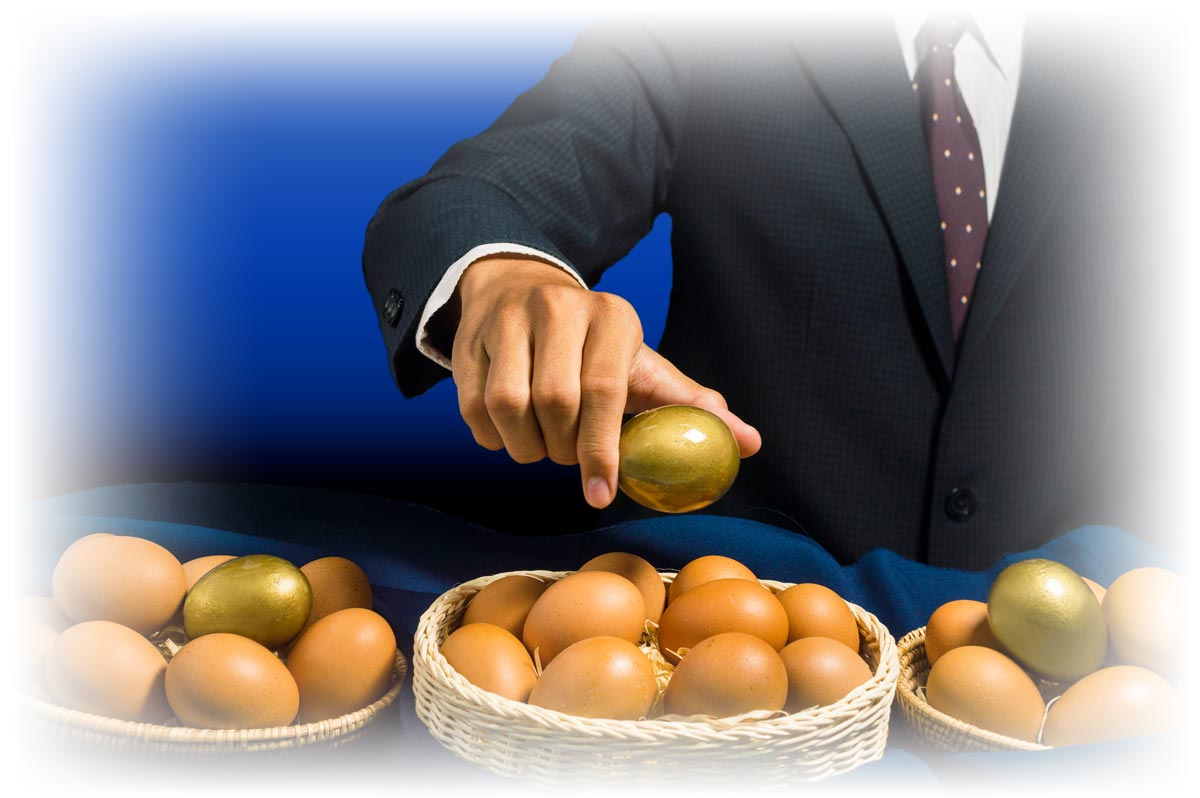 Hand placing golden eggs in multiple baskets