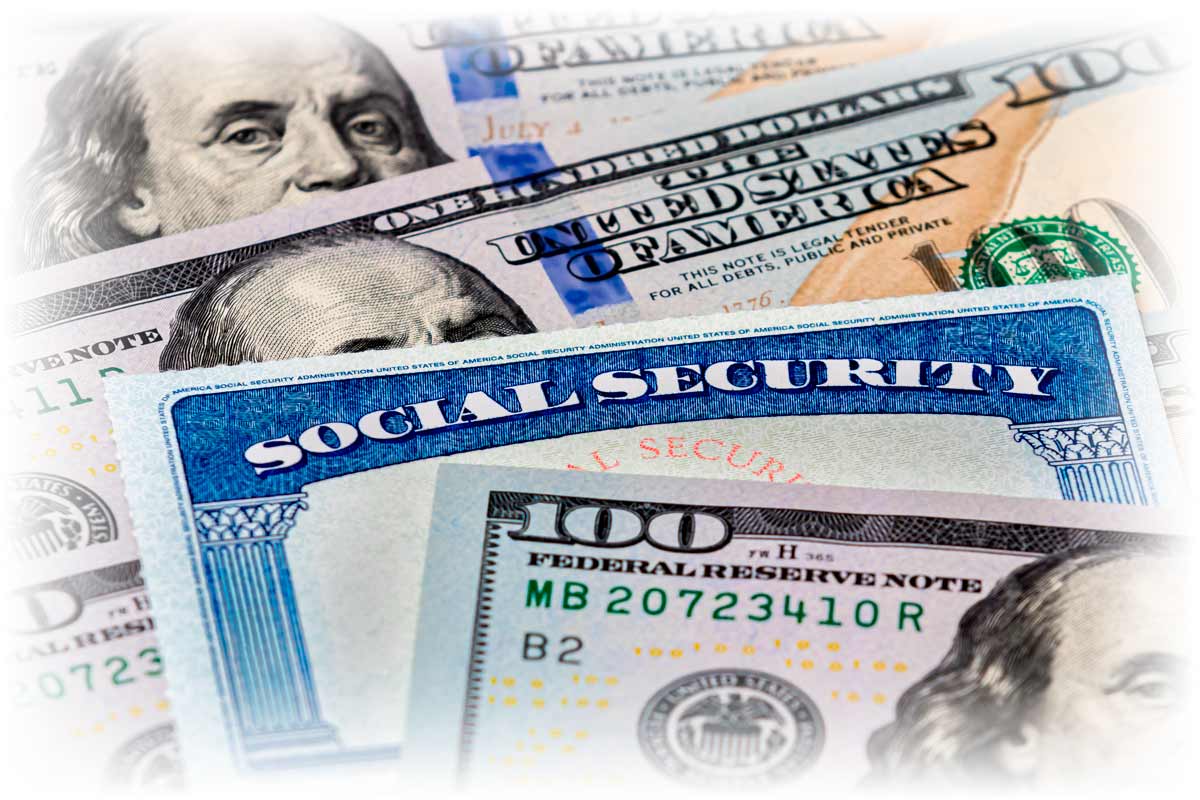 Close-up of Social Security card and $100 notes