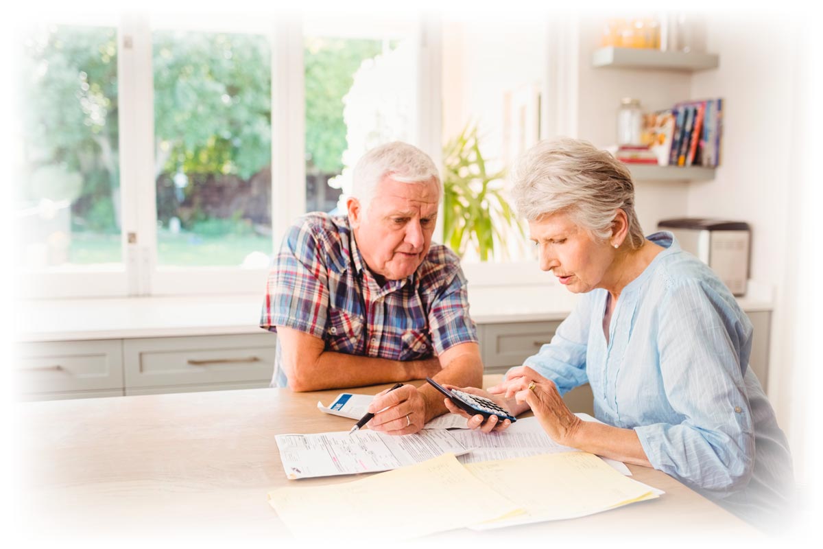 Older couple looking over expenses