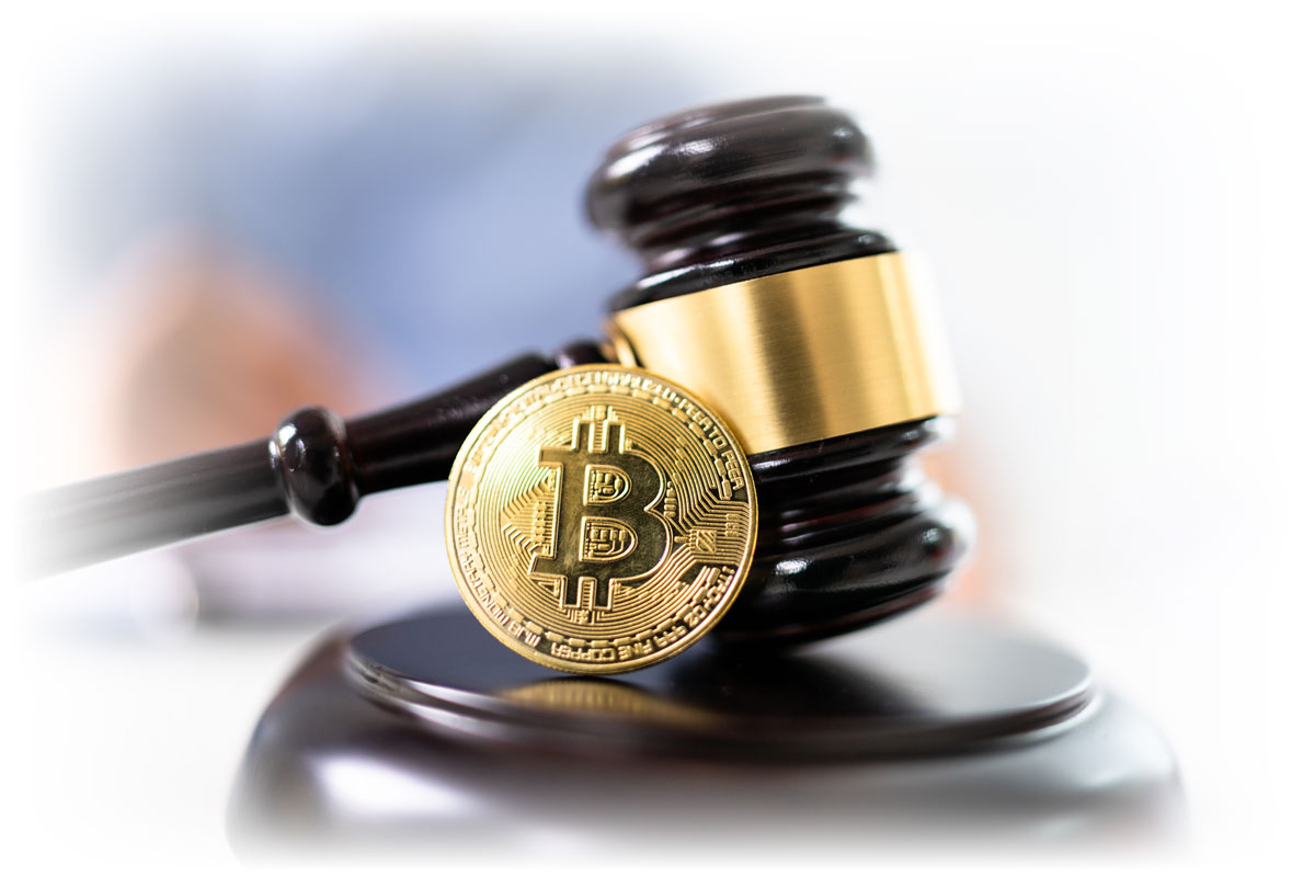 Coin representing Bitcoin resting against gavel