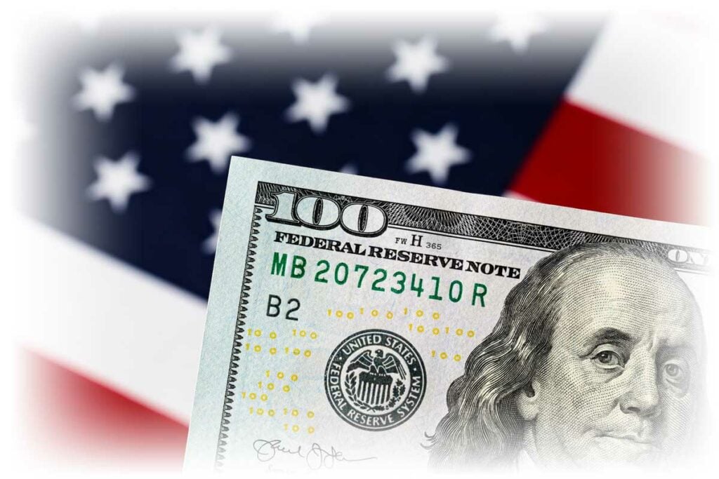 $100 note in front of American flag$100 note in front of American flag