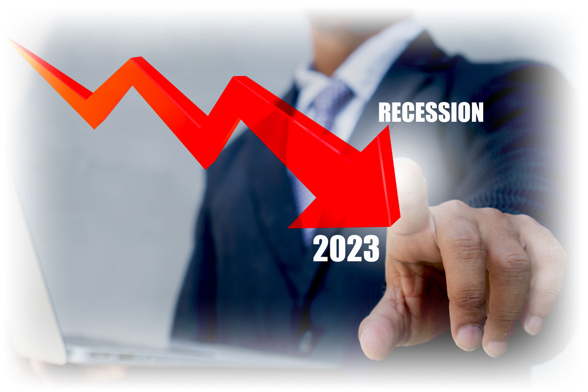 Business person with laptop touching downward red arrow with word "RECESSION"