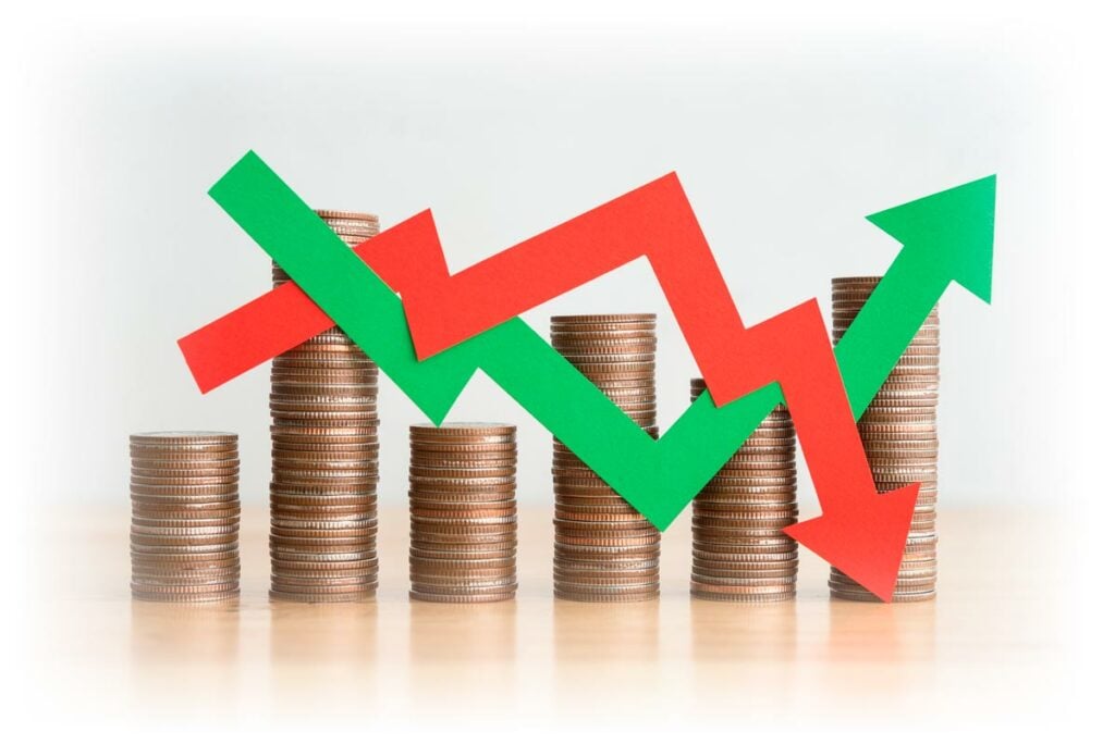 Stack of coins with criss-crossing downward red and upward green arrows