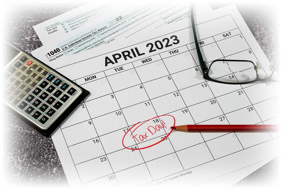 April 2023 calendar with "TAX DAY!" written and circled on April 18