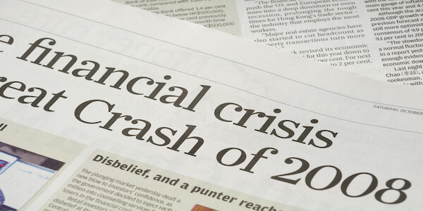 Newspaper headline reading "financial crisis" and "Crash of 2008"