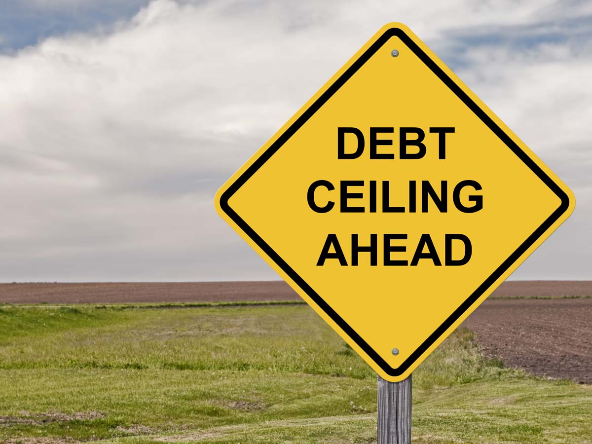 Road sign reading "Debt Ceiling Ahead"
