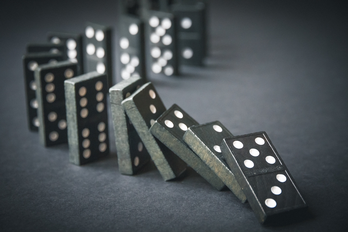 Row of dominoes toppling over