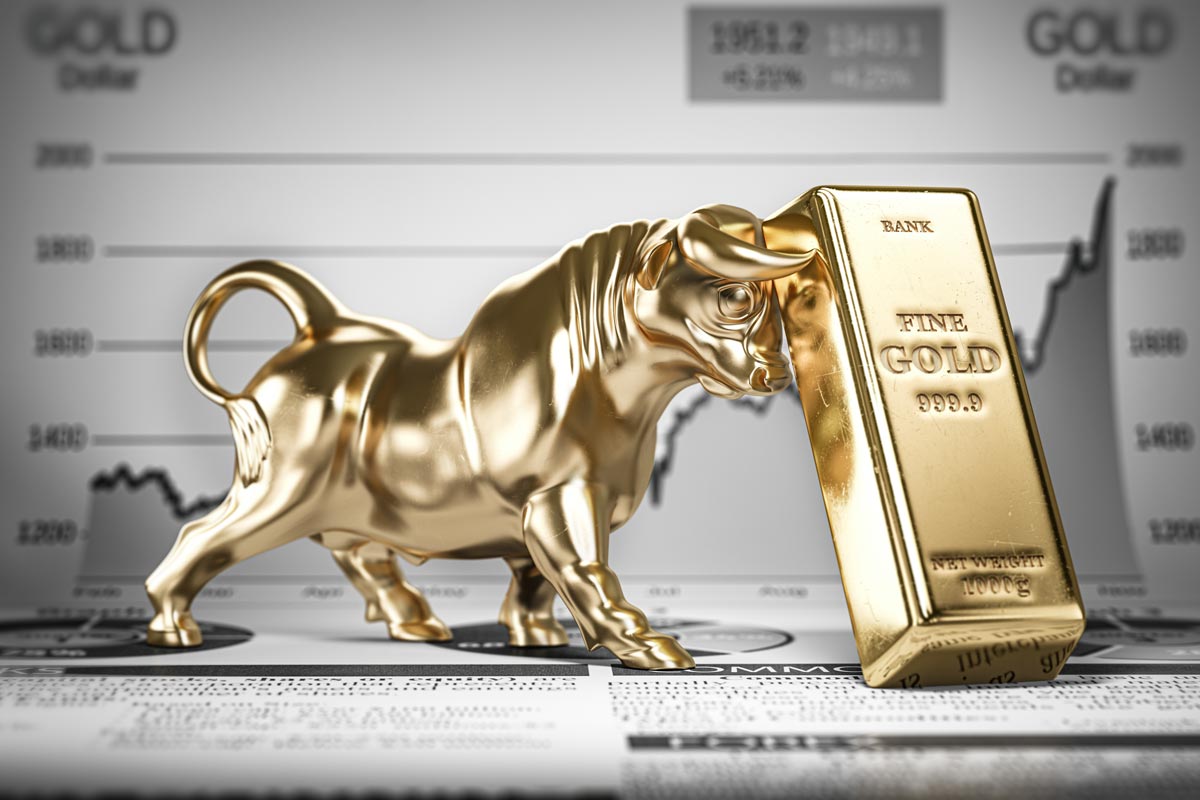 Gold bull pushing against gold bar
